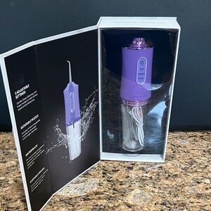 Brand new packaged Purple Cordless Water Flosser